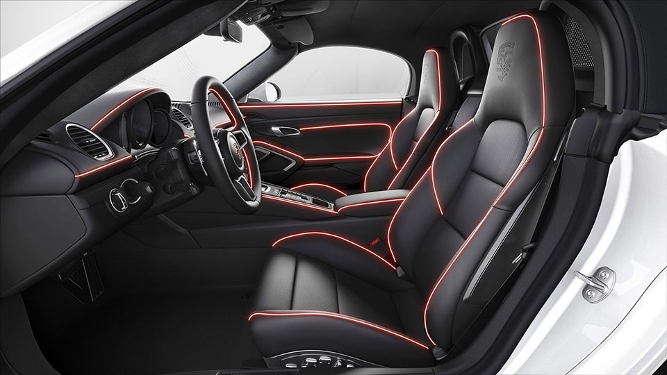 Extended interior trim package with decorative stitching in contrasting colour