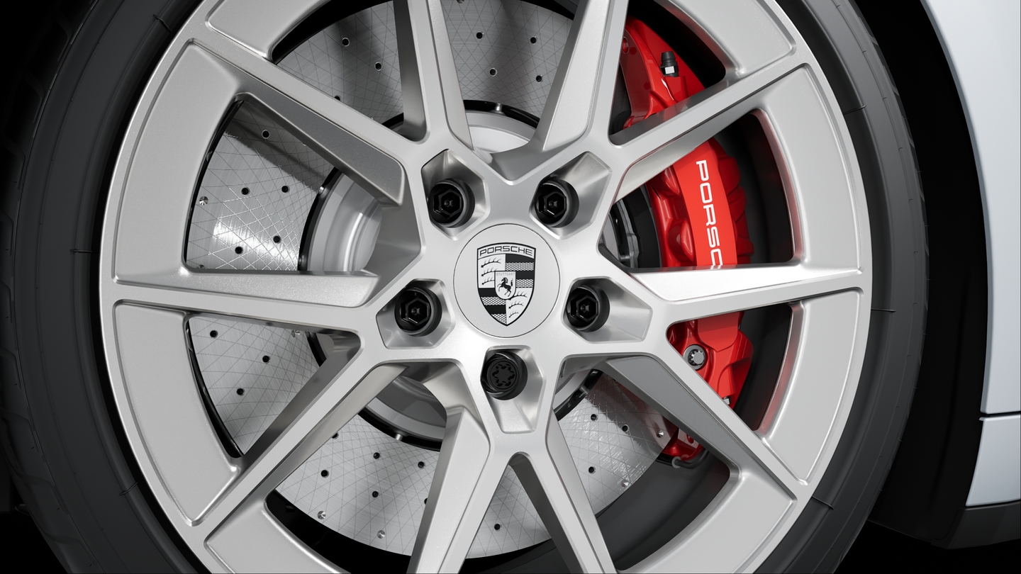 Wheel centre caps with monochrome Porsche crest