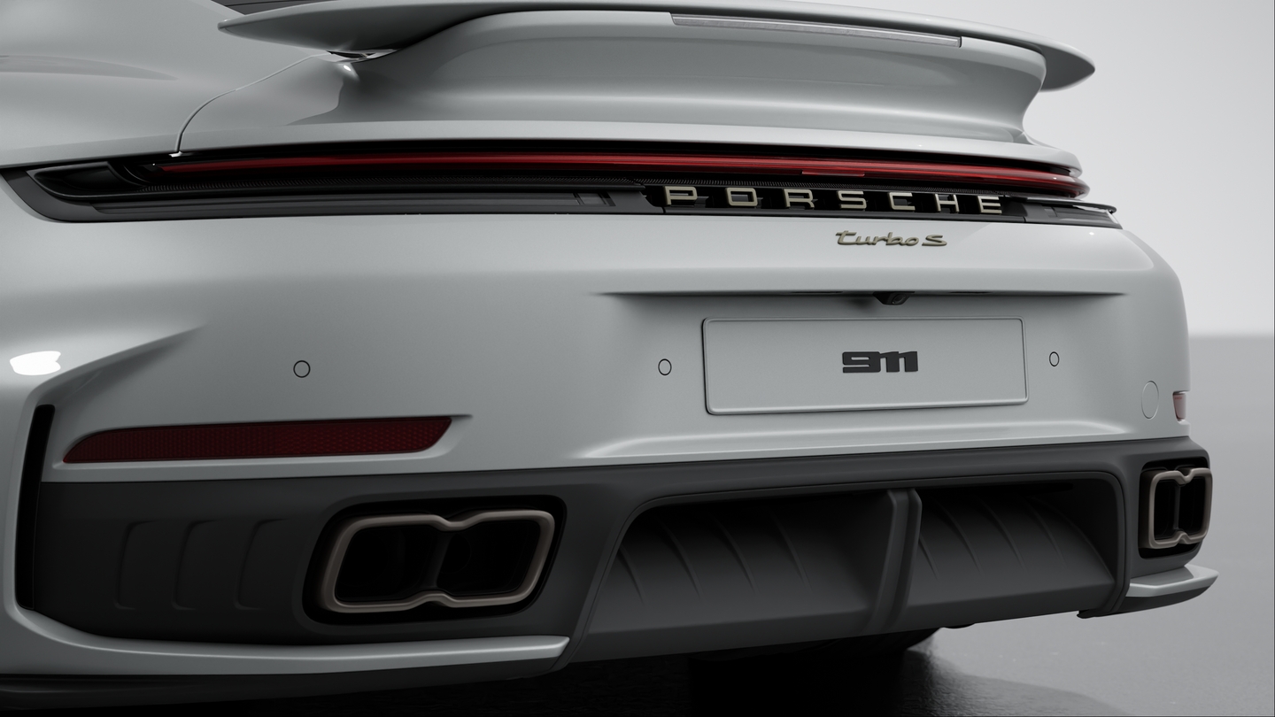 Exhaust system with 2 tube tailpipe trims fixed to the bumper (in Titan)