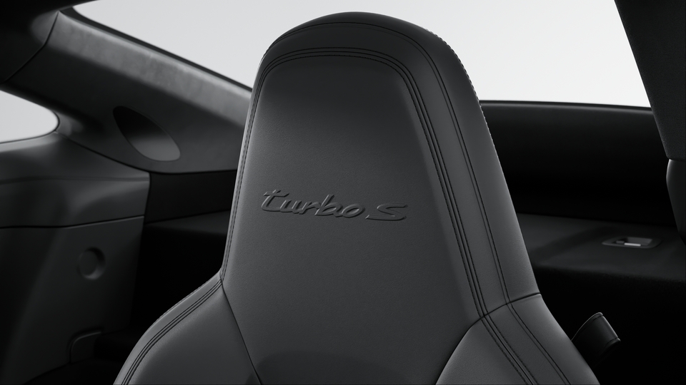 Headrests with embossed model designation