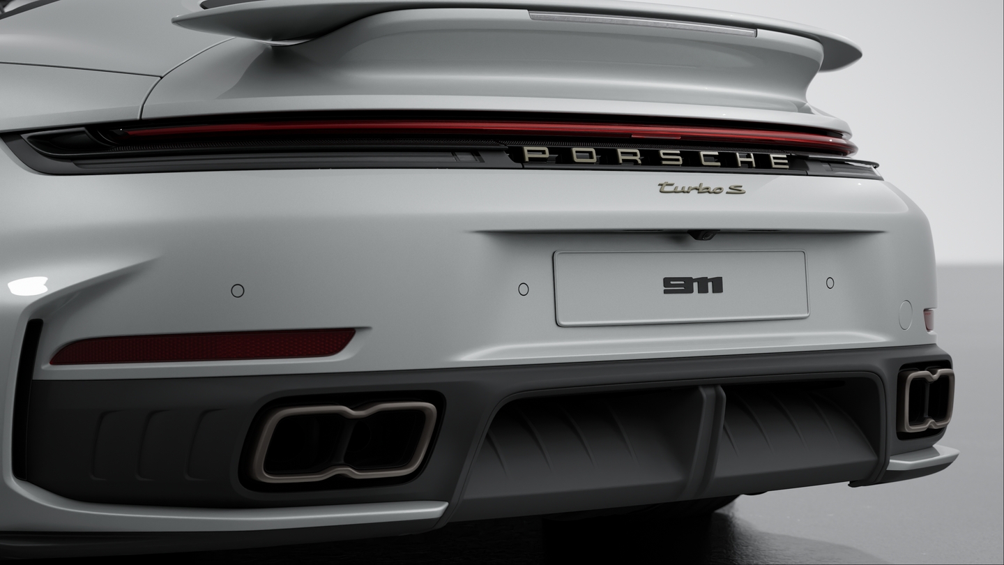 Exhaust system with 2 tube tailpipe trims fixed to the bumper (in Titan)