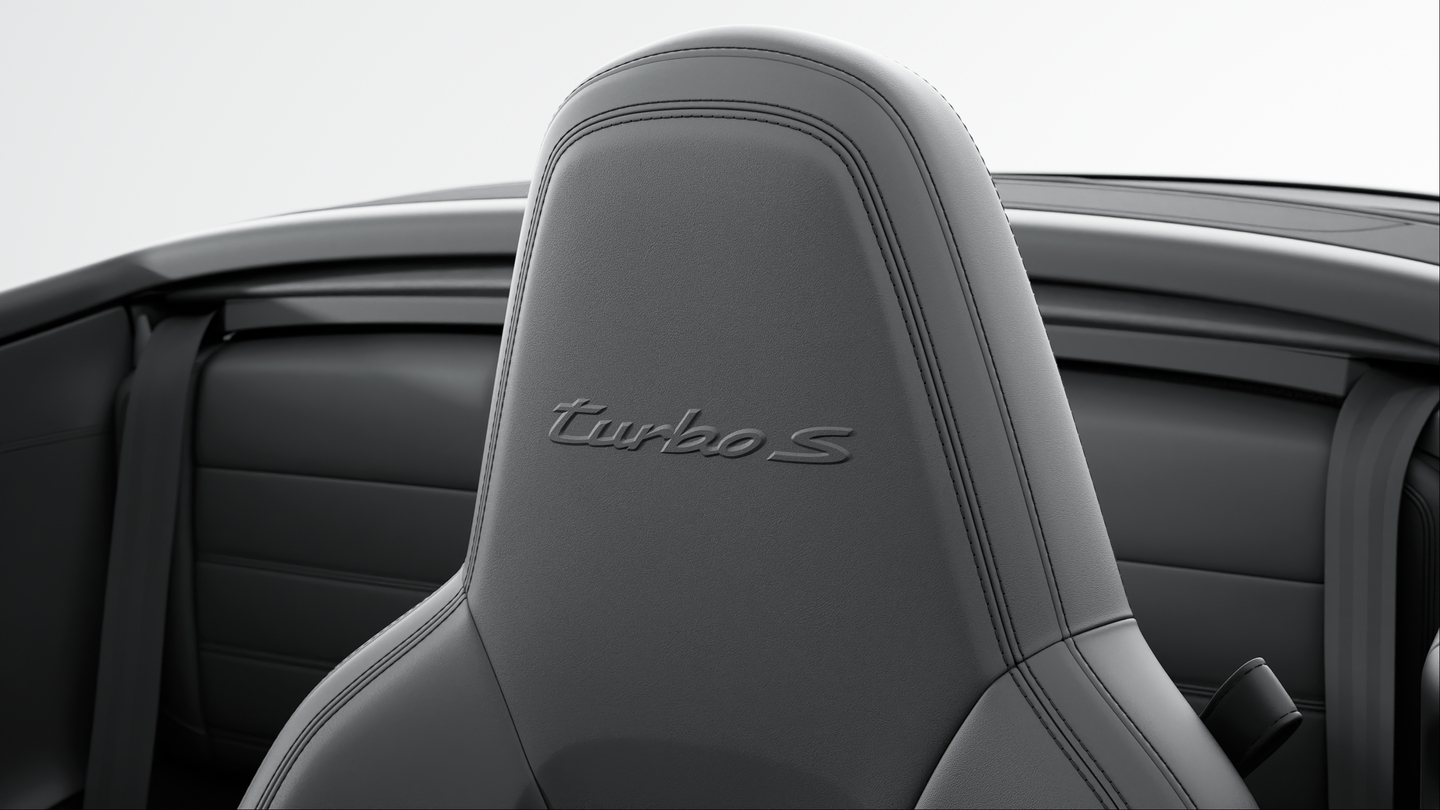 Headrests with embossed model designation