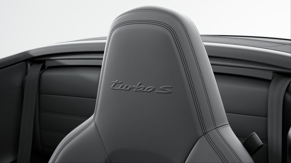 Headrests with embossed model designation