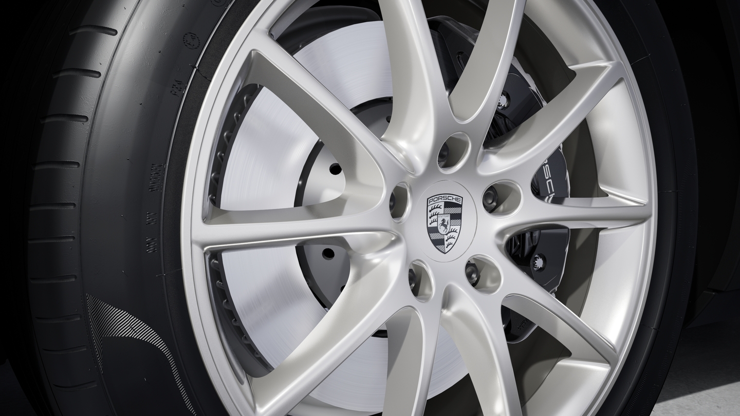 Wheel centre caps with monochrome Porsche crest