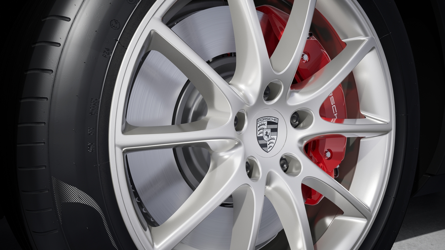 Wheel centre caps with monochrome Porsche crest