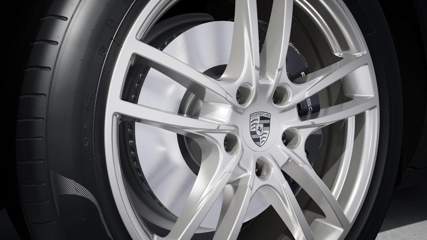 Wheel centre caps with monochrome Porsche crest