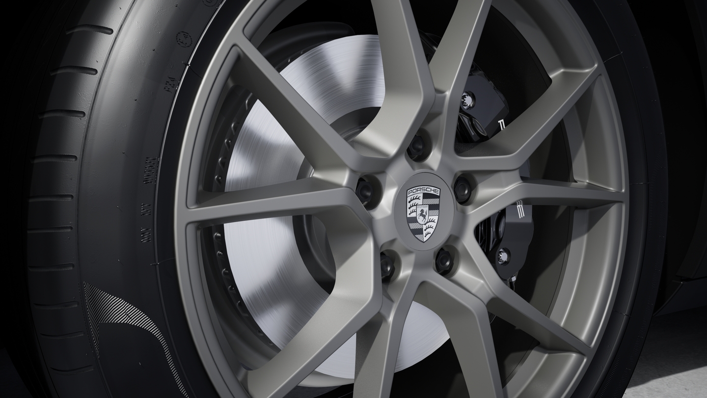 Wheel centre caps with monochrome Porsche crest