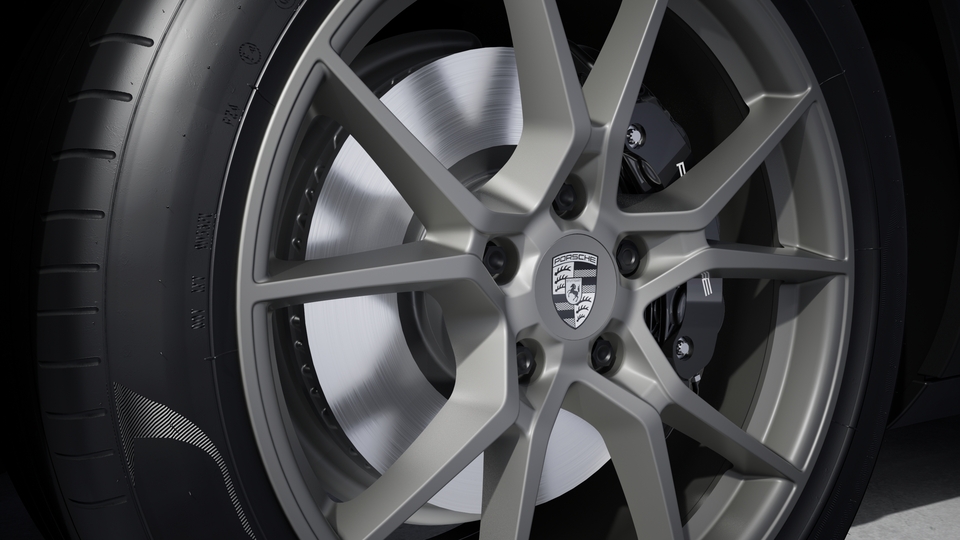 Wheel centre caps with monochrome Porsche crest