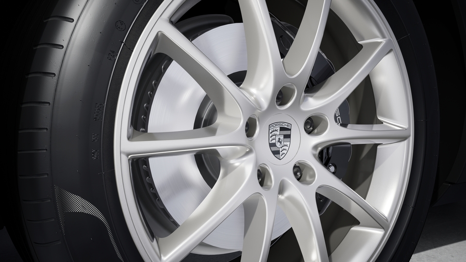 Wheel centre caps with monochrome Porsche crest
