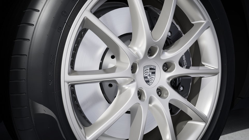 Wheel centre caps with monochrome Porsche crest