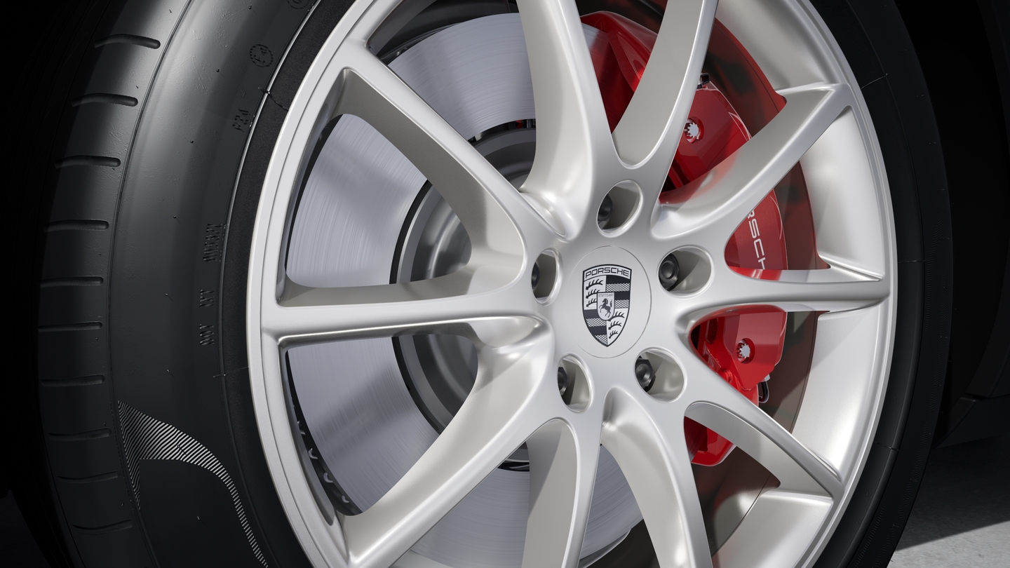 Wheel centre caps with monochrome Porsche crest