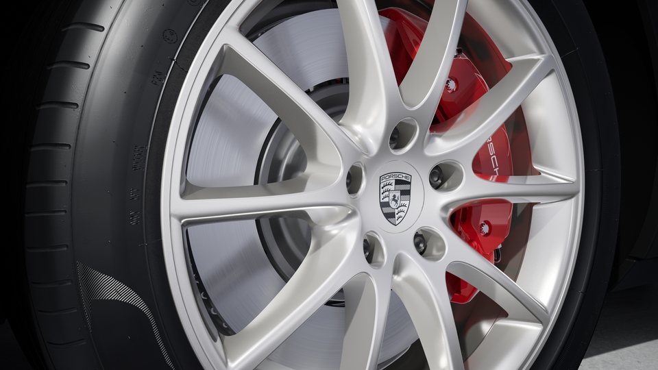Wheel centre caps with monochrome Porsche crest