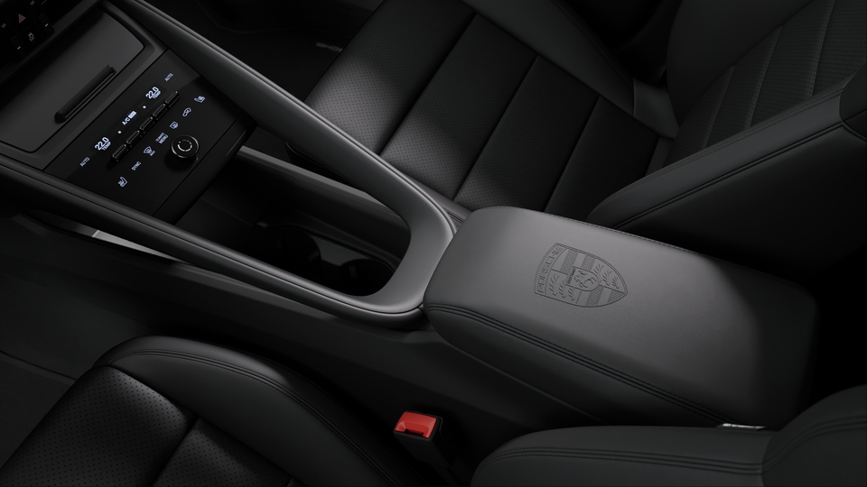 Porsche crest on centre console armrest