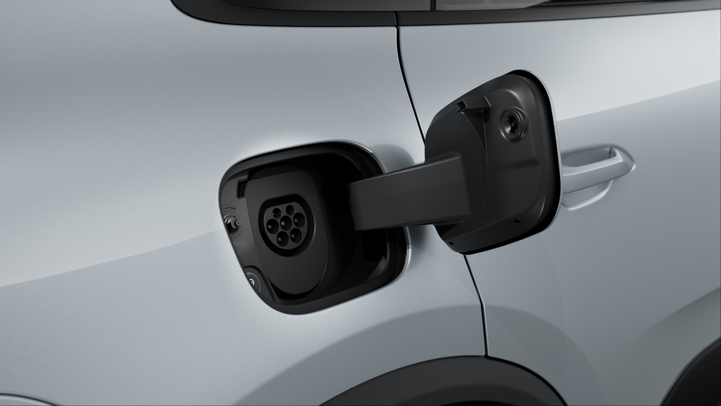 Manual charging port cover