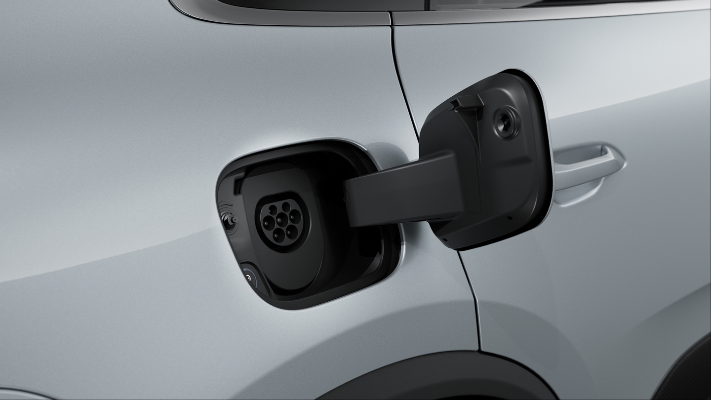 Manual charging port cover