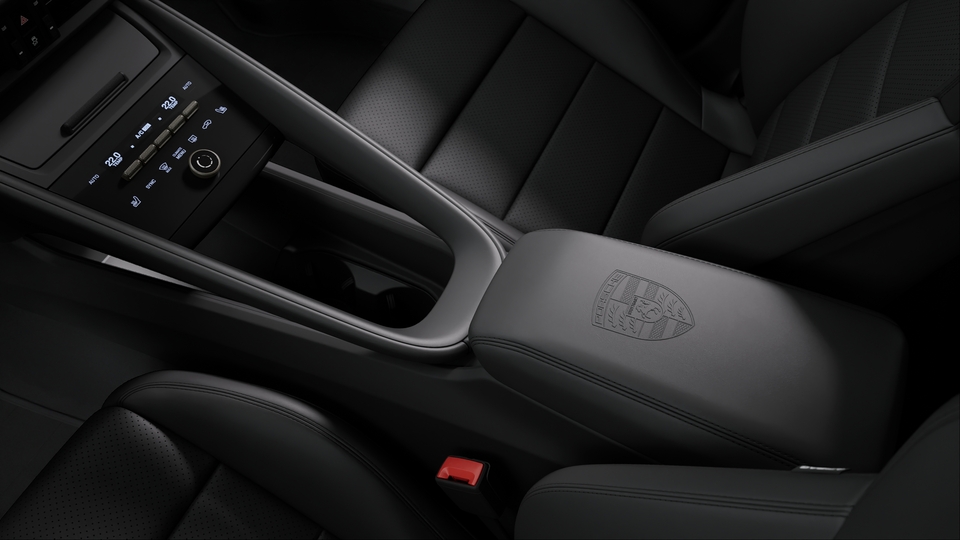 Porsche crest on centre console armrest