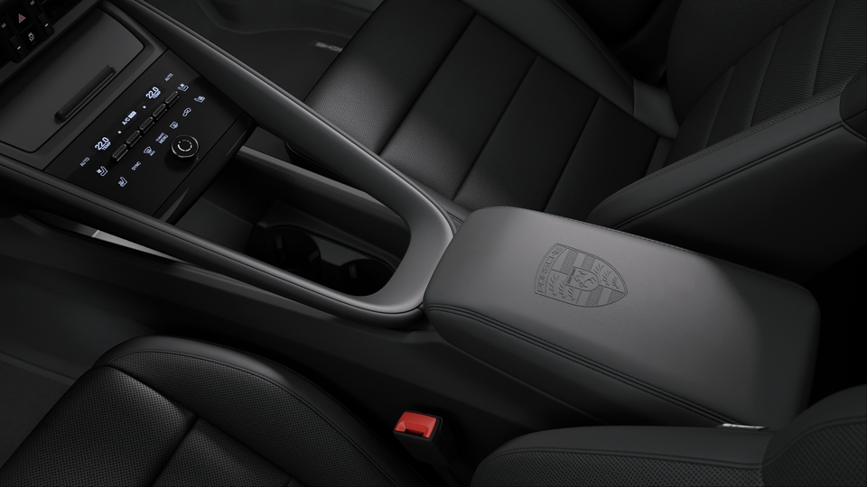 Porsche crest on centre console armrest