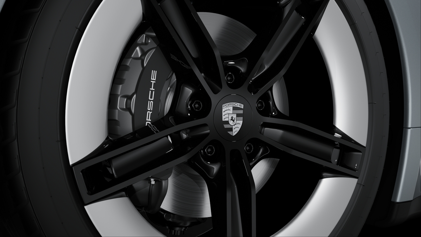 Wheel centre caps with monochrome Porsche crest