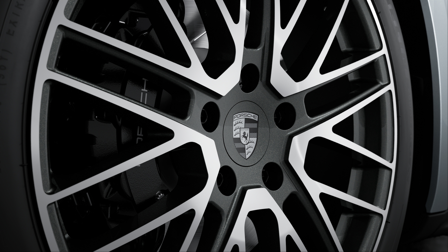 Wheel centre caps with monochrome Porsche crest