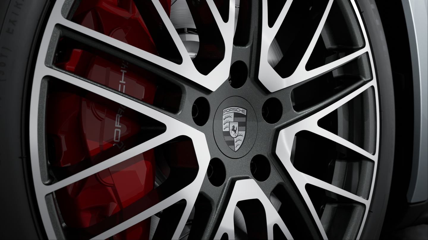 Wheel centre caps with monochrome Porsche crest
