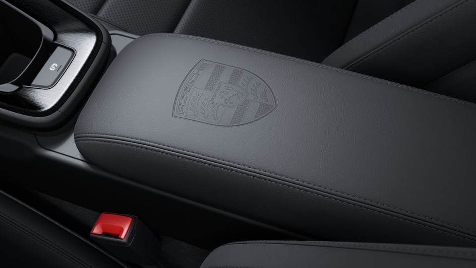 Porsche crest on storage compartment lid