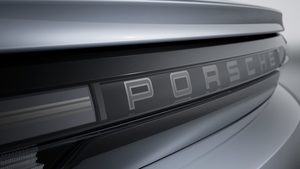 Taillight strip with illuminated 'PORSCHE' lettering and accents in Turbonite